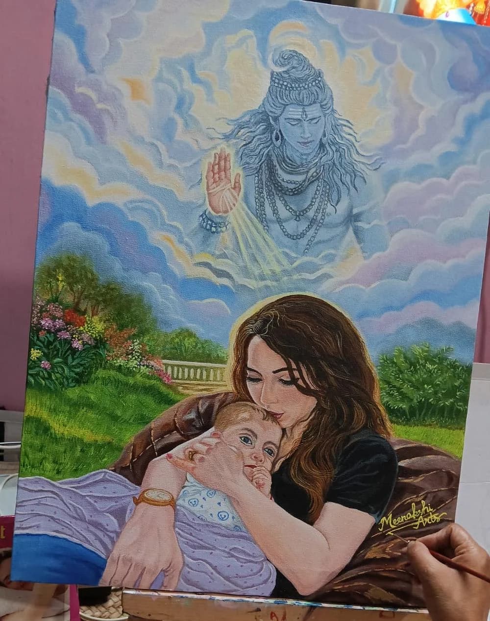 A mother cradling her infant beneath a blessing figure of Shiva