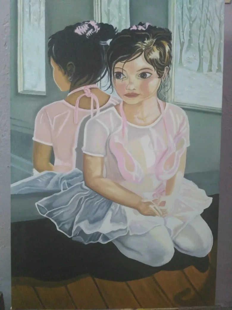Two young ballerinas reflected in a mirror, in muted pastel tones